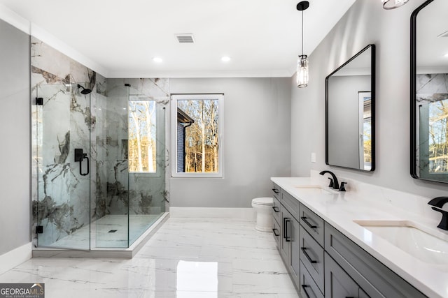 bathroom featuring marble finish floor, a sink, and baseboards