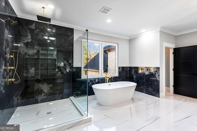 full bathroom featuring marble finish floor, a stall shower, a soaking tub, and visible vents