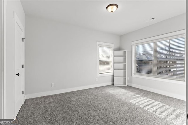 unfurnished bedroom featuring carpet