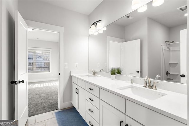 bathroom featuring tile patterned floors, vanity, and shower / washtub combination