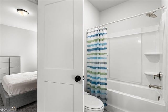 bathroom with toilet and shower / bath combo