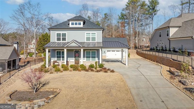 view of front facade with covered porch and a garage