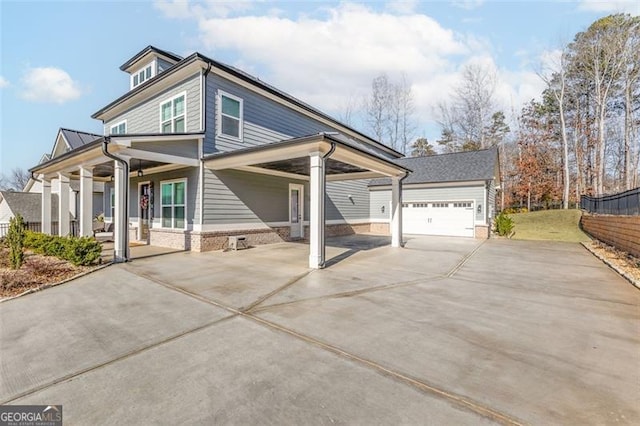 view of front of house with a garage, an outbuilding, and covered porch