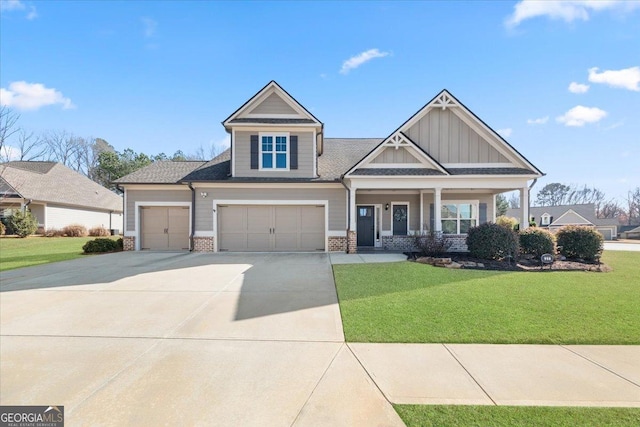 craftsman house with covered porch and a front lawn