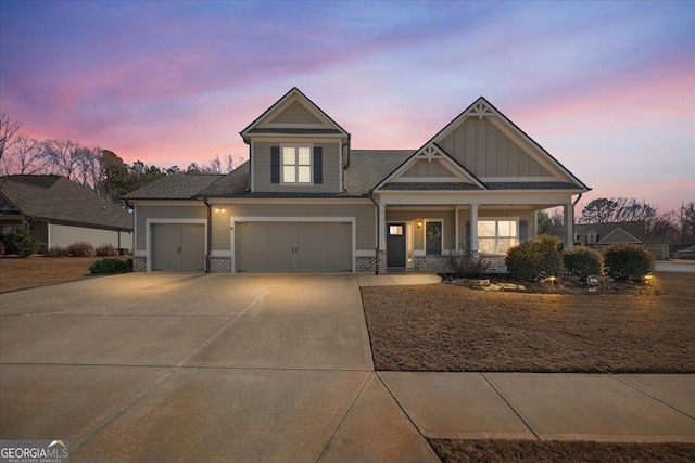 view of front of house featuring a garage and a porch