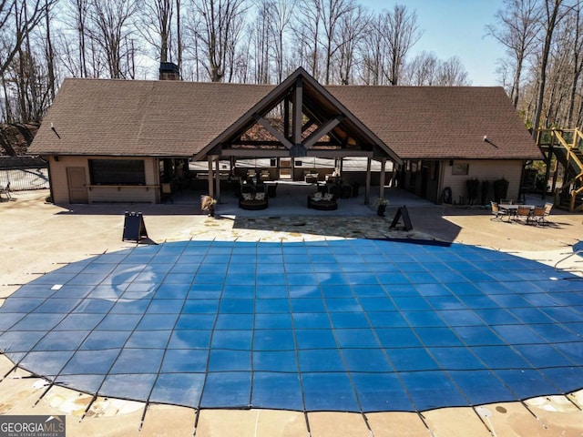 view of pool featuring a patio