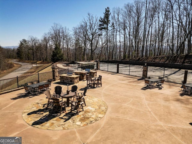 view of patio featuring an outdoor fire pit