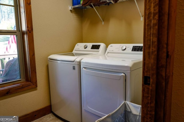 laundry area with washing machine and clothes dryer