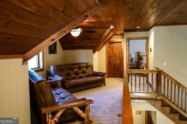 interior space featuring wood ceiling, carpet floors, ceiling fan, and vaulted ceiling