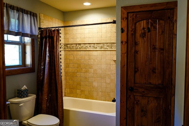 bathroom with shower / bathtub combination with curtain and toilet