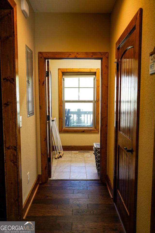 corridor with light hardwood / wood-style floors