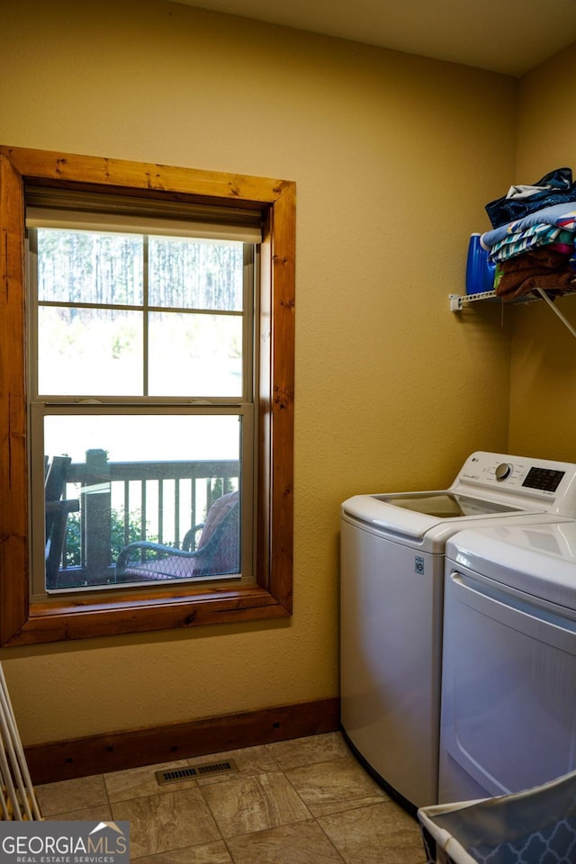 laundry area with washer and clothes dryer