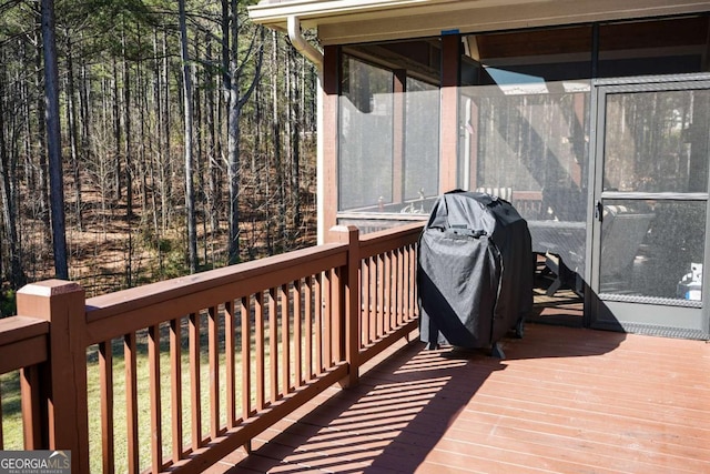 wooden terrace with area for grilling