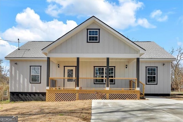 rear view of house with a porch