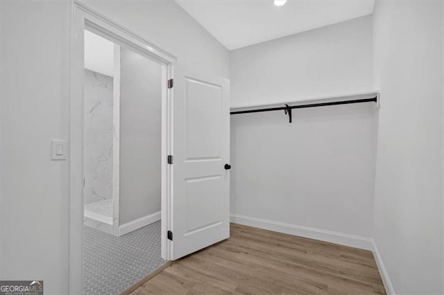 walk in closet featuring light hardwood / wood-style floors