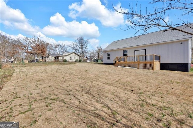 exterior space with a yard and a deck