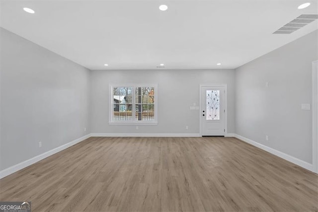 unfurnished living room featuring light wood-type flooring