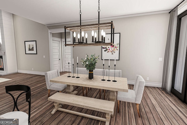 dining area featuring wood finished floors and baseboards