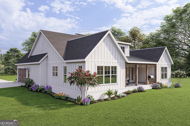 view of front of home featuring board and batten siding, concrete driveway, a front yard, roof with shingles, and covered porch