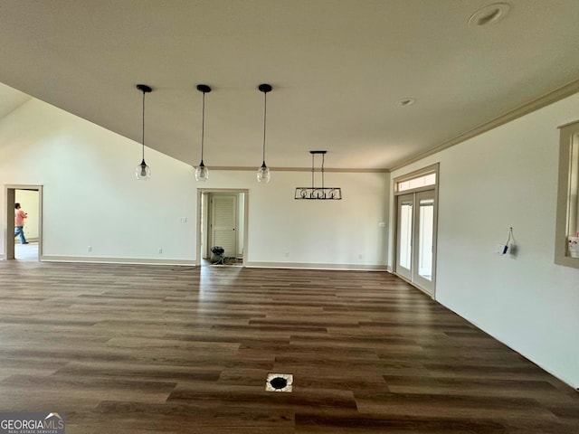 unfurnished living room featuring french doors, baseboards, dark wood-style flooring, and crown molding