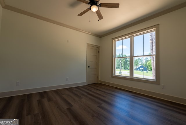 unfurnished room featuring dark wood finished floors, ornamental molding, a ceiling fan, and baseboards