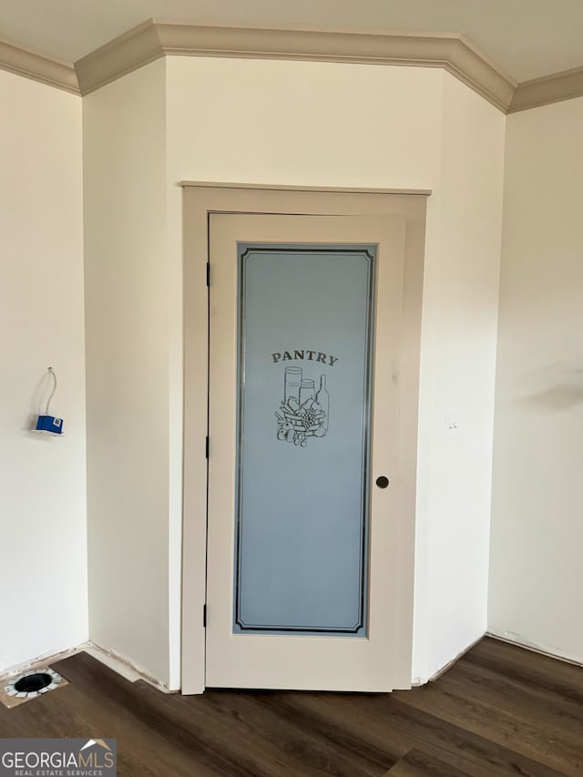 room details with wood finished floors and crown molding