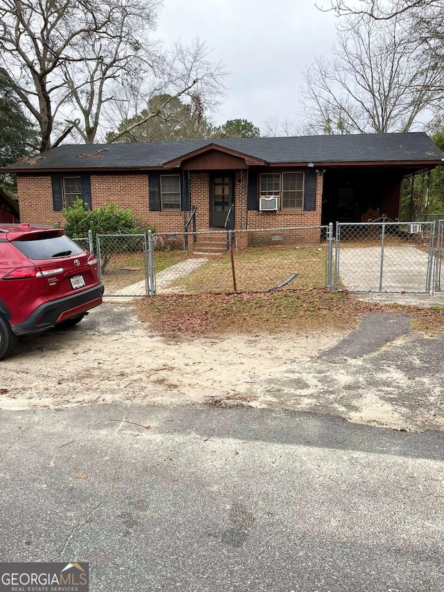 ranch-style house featuring a carport