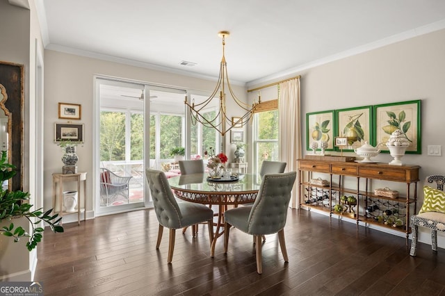 dining area with ornamental molding, a chandelier, and dark hardwood / wood-style flooring