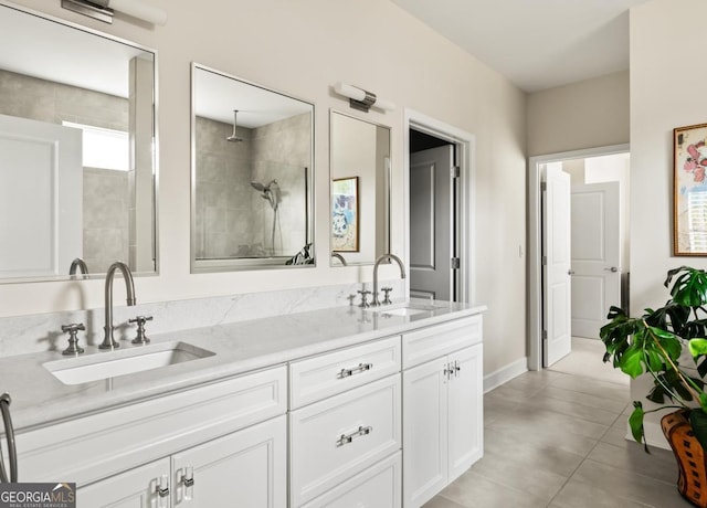 bathroom featuring vanity and a tile shower