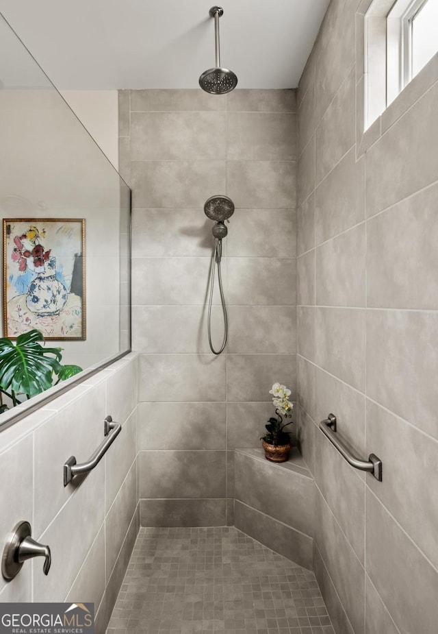 bathroom with a tile shower