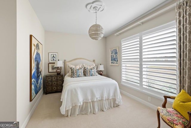 bedroom with light colored carpet