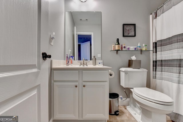 bathroom with curtained shower, toilet, visible vents, vanity, and tile patterned floors