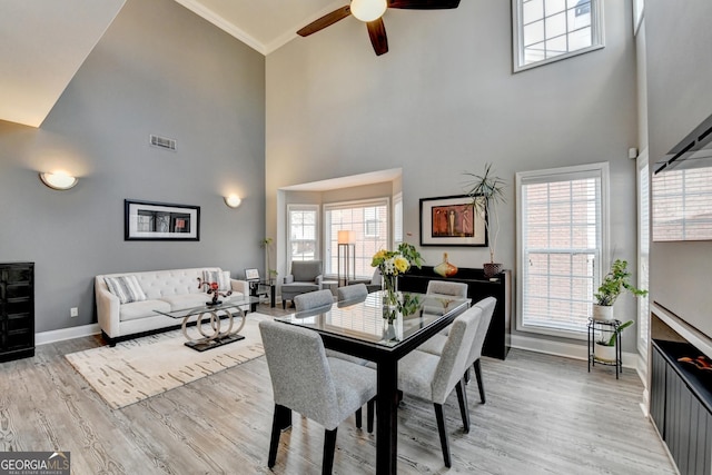 dining area with baseboards, a healthy amount of sunlight, visible vents, and light wood-style floors