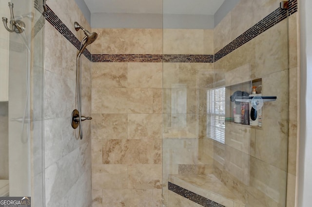 bathroom featuring tiled shower