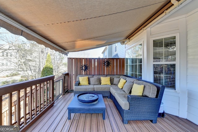 wooden terrace featuring an outdoor living space