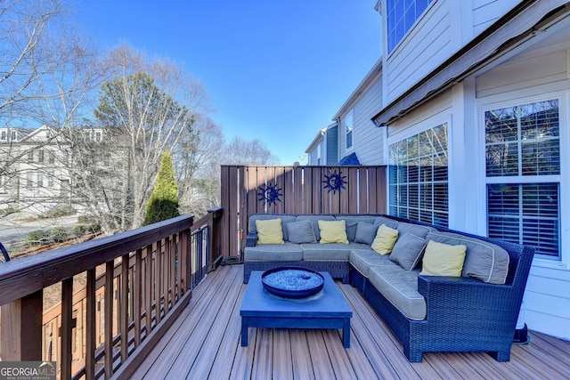 wooden terrace with outdoor lounge area