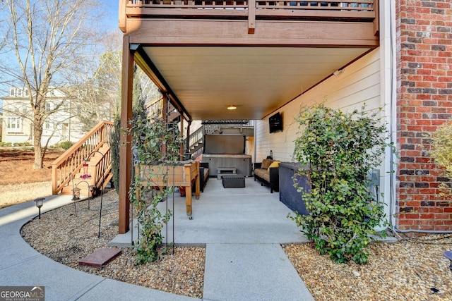 view of patio / terrace featuring stairs and outdoor lounge area