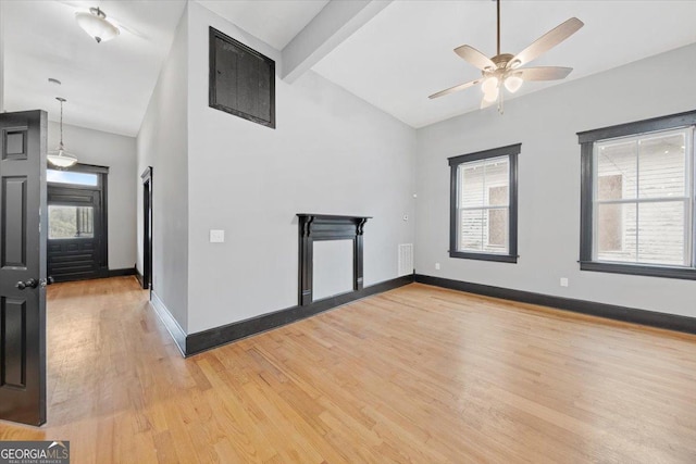 unfurnished room featuring lofted ceiling with beams, ceiling fan, and light wood-type flooring