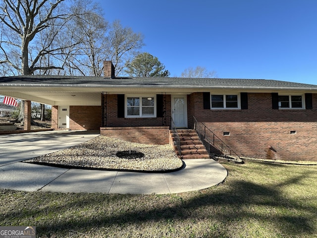 ranch-style home featuring a carport