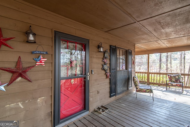 view of exterior entry featuring a porch