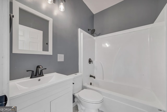 full bathroom with vanity, shower / tub combination, and toilet