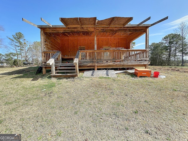 rear view of property featuring a deck