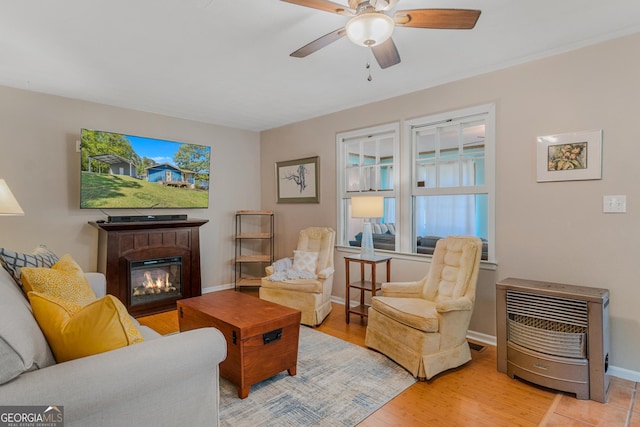 living room featuring ceiling fan and light wood-type flooring