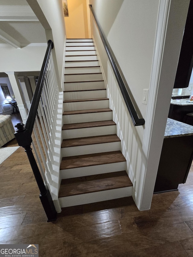 stairs featuring hardwood / wood-style flooring