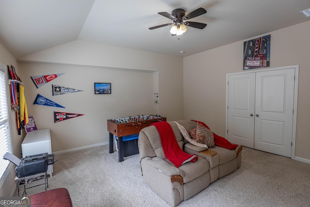 game room featuring vaulted ceiling, ceiling fan, and light colored carpet