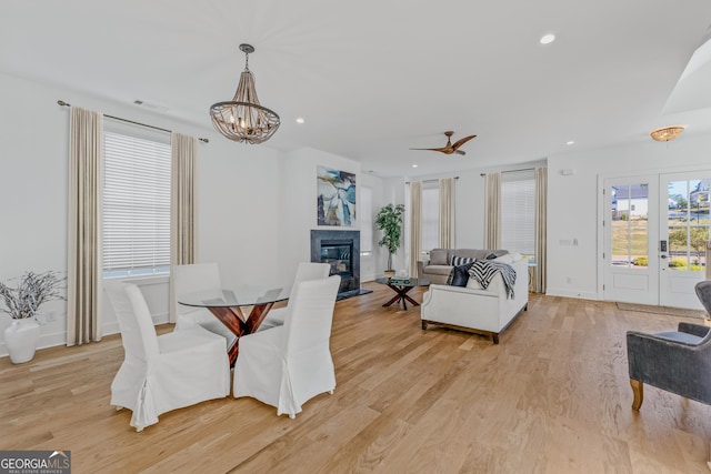 dining room with a chandelier and light wood-type flooring