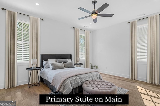 bedroom with ceiling fan and light wood-type flooring