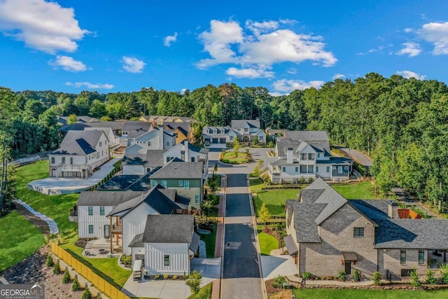 aerial view with a residential view and a wooded view