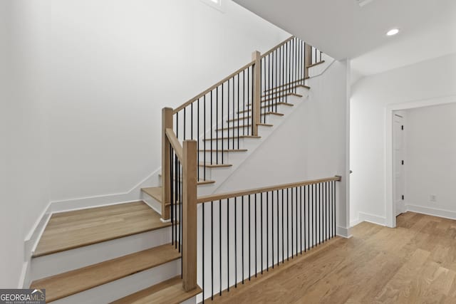 stairs with wood-type flooring