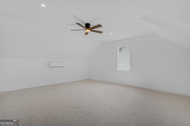 additional living space featuring ceiling fan, light colored carpet, and lofted ceiling